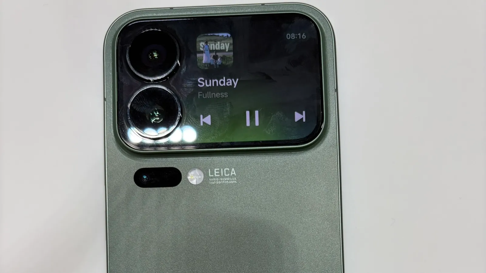 The back of a green Xiaomi 17 Pro with its rear screen on