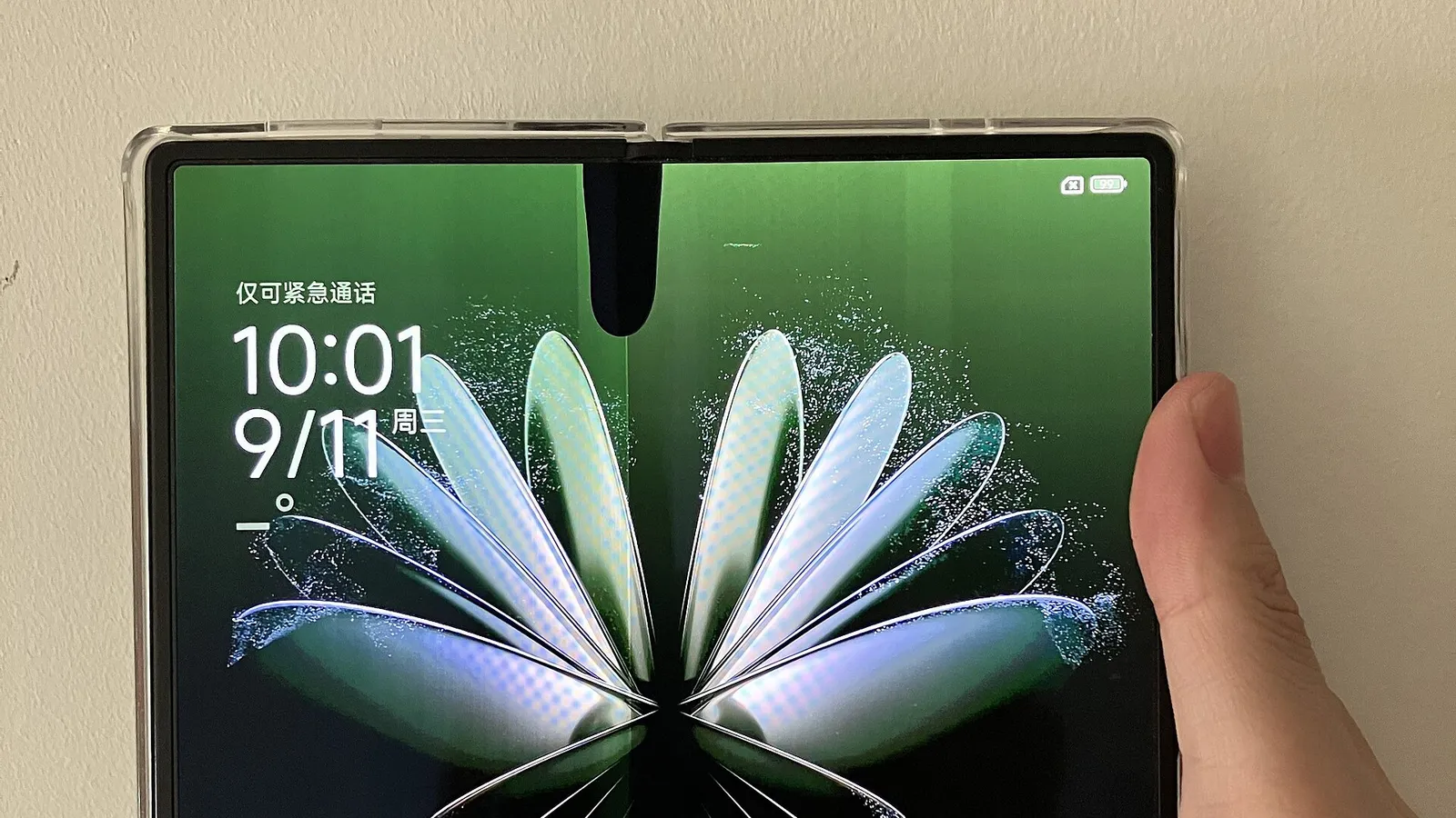A Xiaomi foldable phone held open
